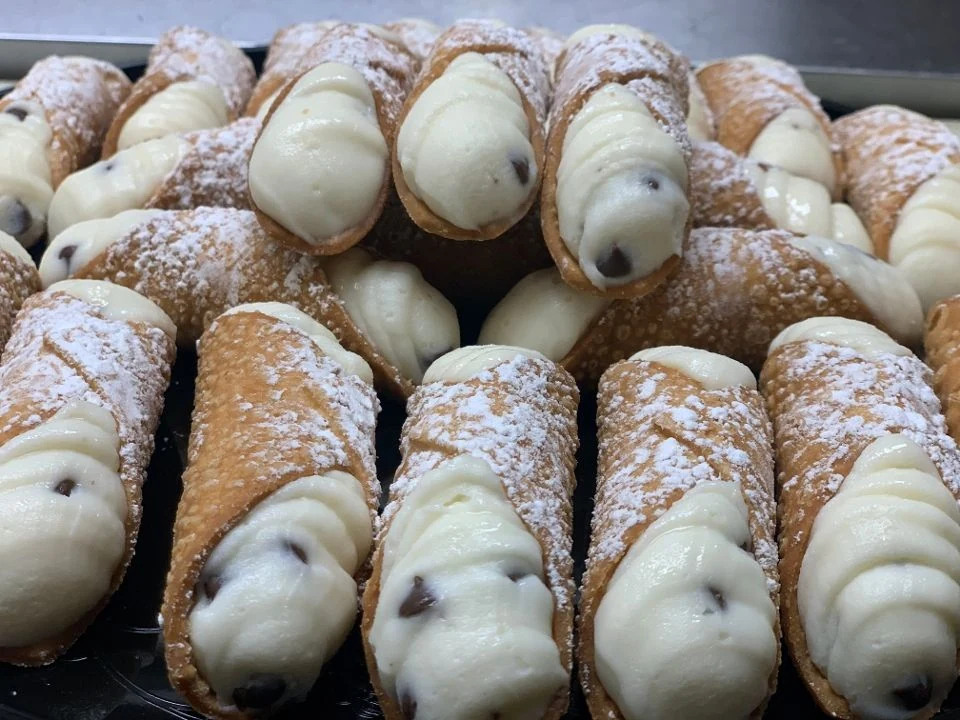 Pastore’s filled cannoli dusted with powdered sugar